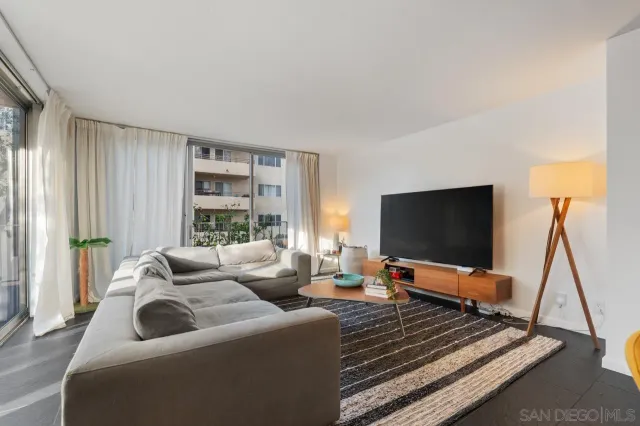 a lobby with furniture and a potted plant