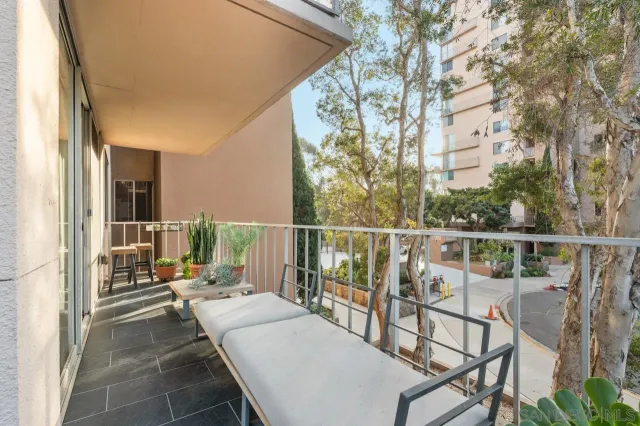 a bathroom with a granite countertop sink a mirror and a