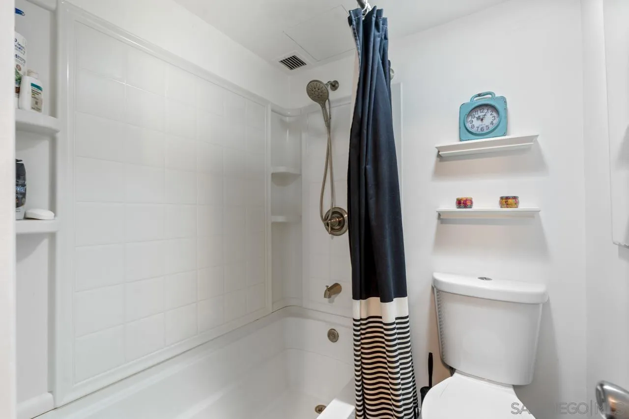 3635 7th Avenue, Unit 2D San Diego, CA 92103 - Photo 35 of 68 a bathroom with a shower a toilet and a sink