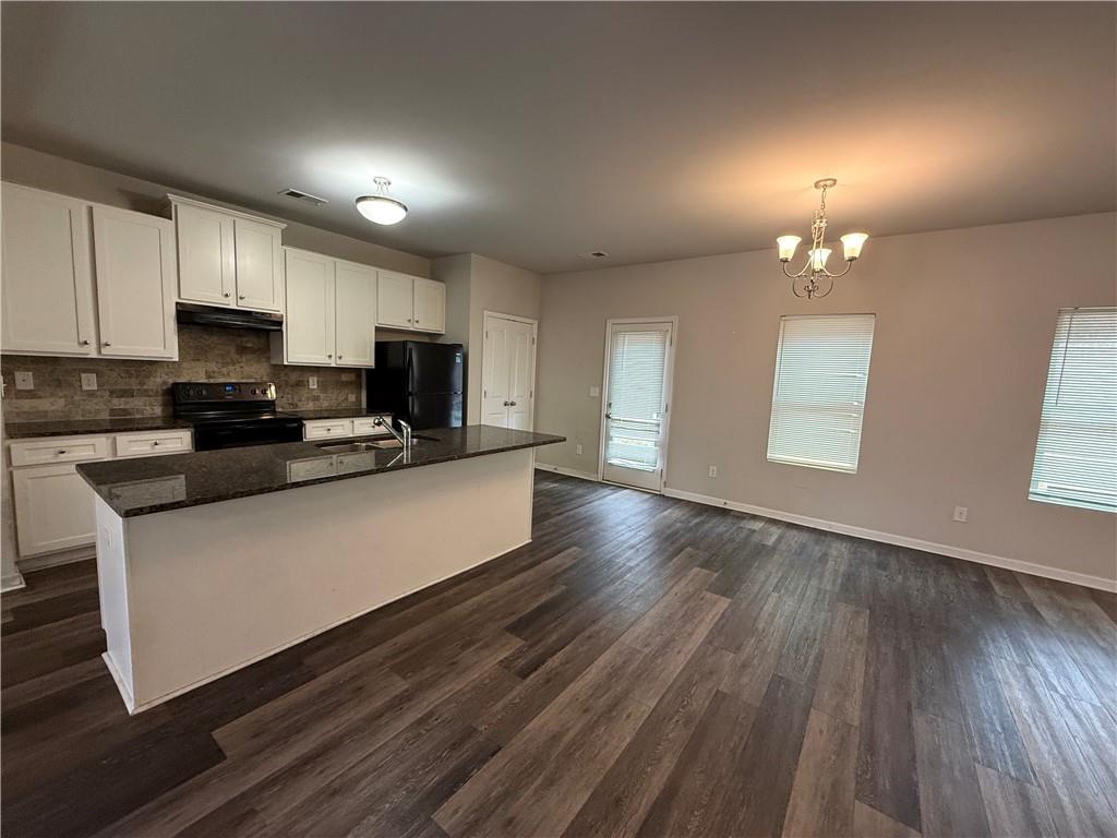 4299 Traipse Path Ellenwood, GA 30294 - Photo 2 of 12 a kitchen with stainless steel appliances a refrigerator sink and microwave