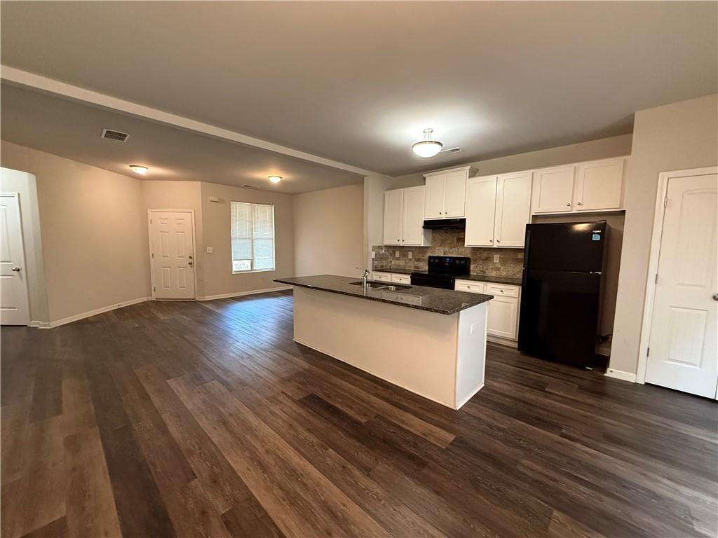 4299 Traipse Path Ellenwood, GA 30294 - Photo 4 of 12 a kitchen with counter top space and refrigerator