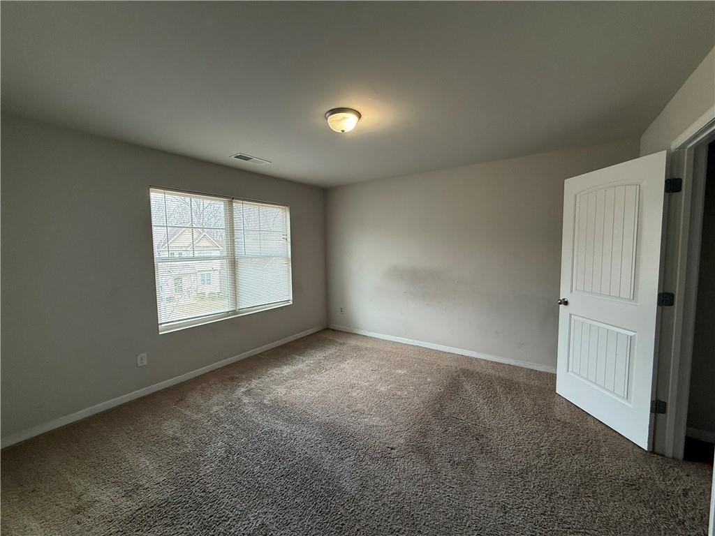 4299 Traipse Path Ellenwood, GA 30294 - Photo 10 of 12 an empty room with windows