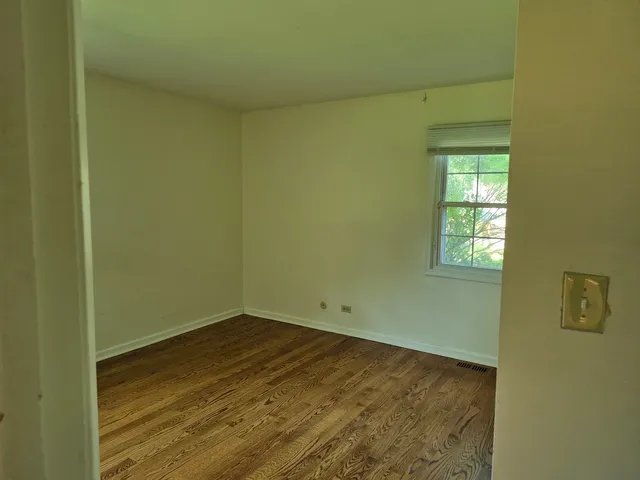 a view of a room that has a window