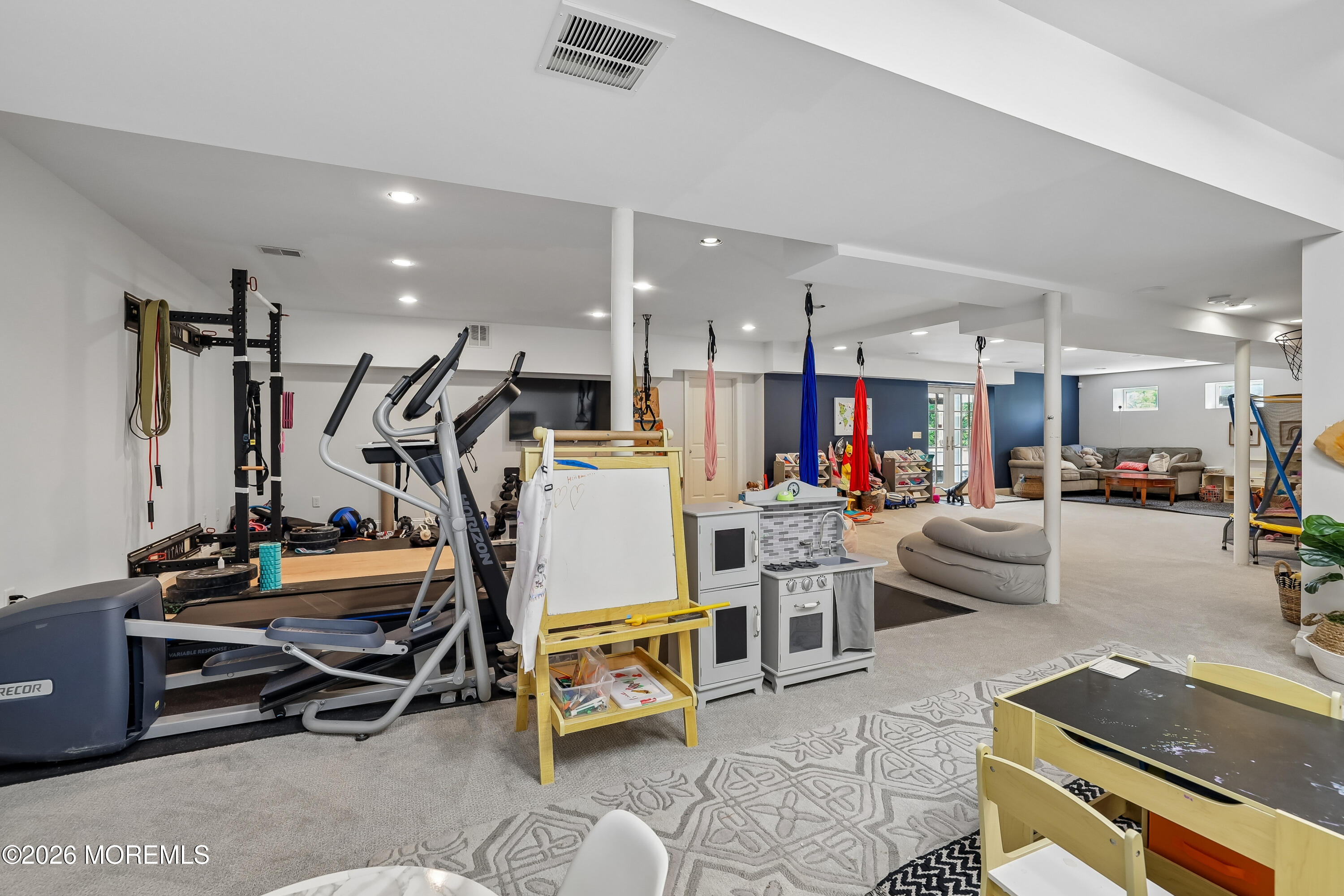 92 Tulip Lane Colts Neck, NJ 07722 - Photo 38 of 55 a view of a room with gym equipment