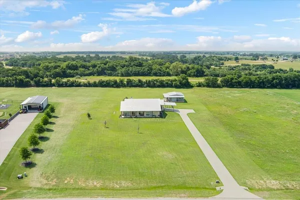a view of a swimming pool with a yard