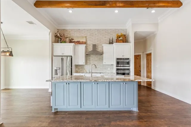 a view of kitchen with furniture and wooden floor