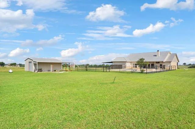 a view of a house with a big yard