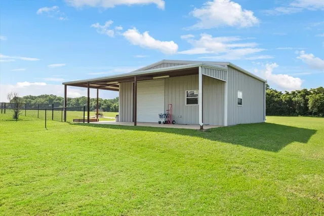 a view of a backyard with a garden and plants