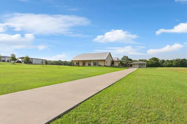 a view of field with river in front of it