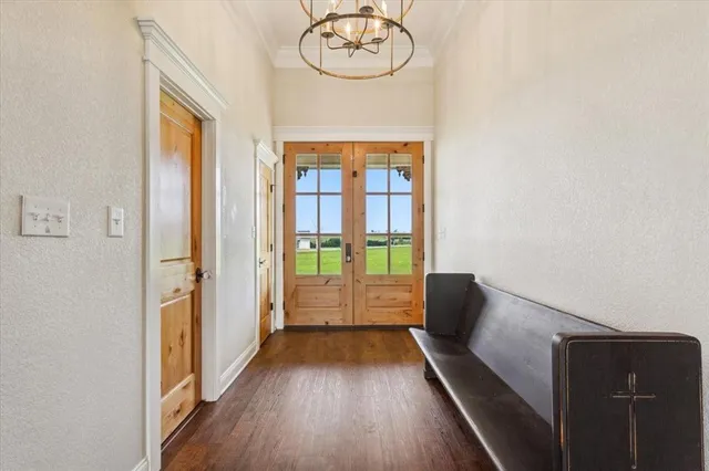 a hallway with furniture and wooden floor