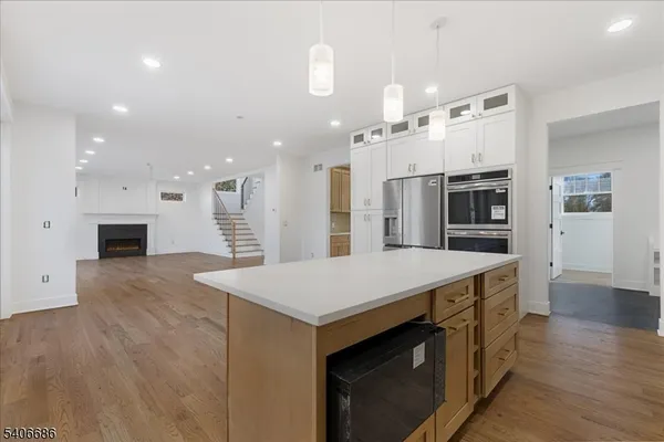 a view of staircase and kitchen with sink