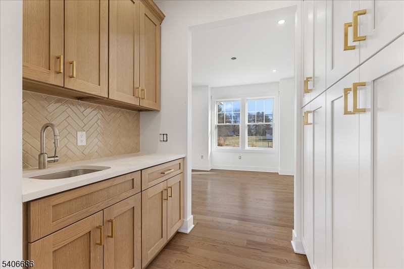 759 Mechlin Corner Road Hampton, NJ 08827 - Photo 12 of 49 a kitchen with white cabinets and sink