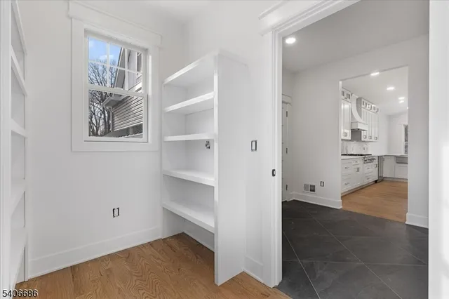 a view of a kitchen with wooden floor