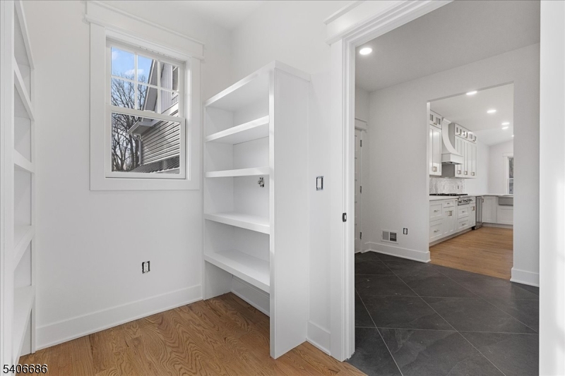 759 Mechlin Corner Road Hampton, NJ 08827 - Photo 19 of 49 a view of a hallway with wooden floor and a cabinet