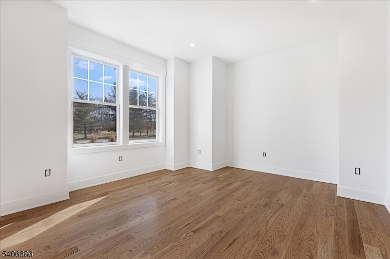 759 Mechlin Corner Road Hampton, NJ 08827 - Photo 22 of 49 a view of an empty room with wooden floor and a window