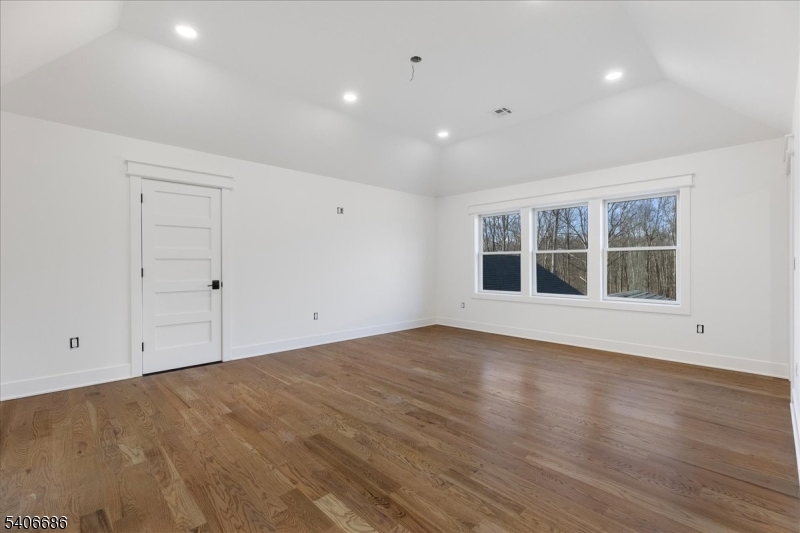 759 Mechlin Corner Road Hampton, NJ 08827 - Photo 27 of 49 a view of empty room with wooden floor and fan