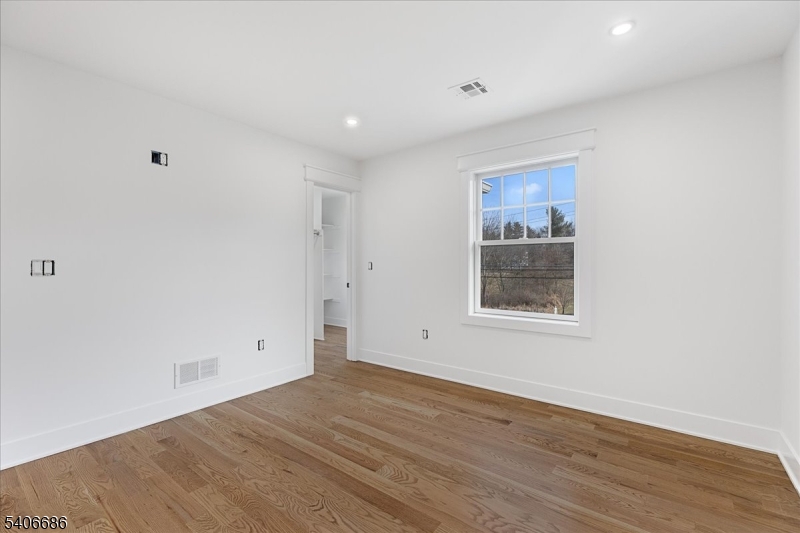 759 Mechlin Corner Road Hampton, NJ 08827 - Photo 36 of 49 a view of an empty room with wooden floor and a window