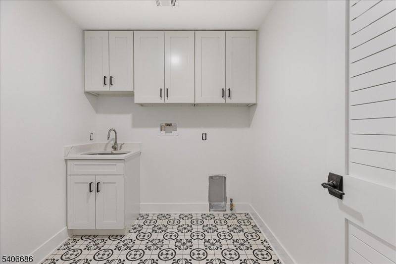 759 Mechlin Corner Road Hampton, NJ 08827 - Photo 40 of 49 a room with a sink and cabinets