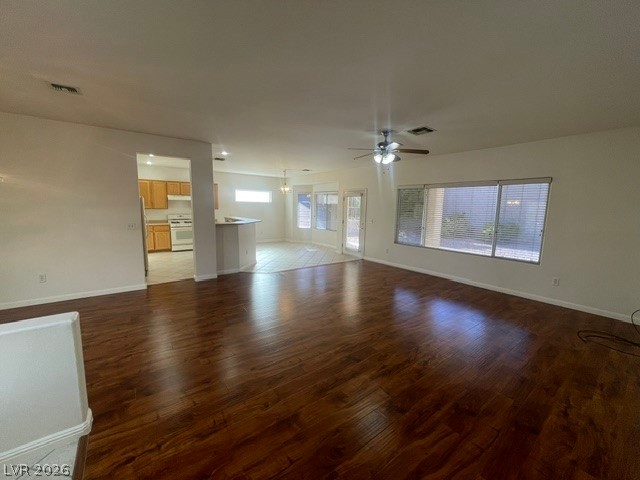 3047 Hickory Valley Road Henderson, NV 89052 - Photo 3 of 21 Rich hardwood flooring creates a seamless flow through this adaptable open living area.