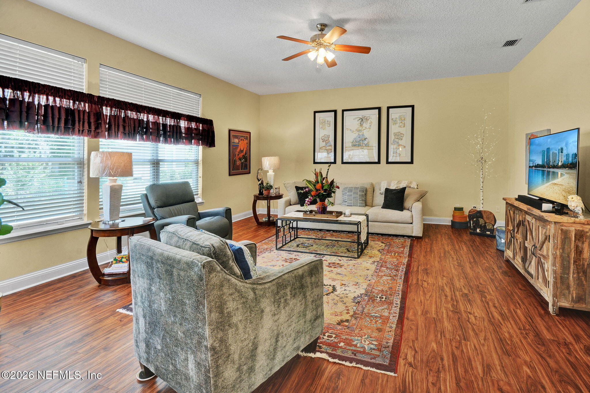 5950 West Shores Road Orange Park, FL 32003 - Photo 18 of 42 a living room with furniture and a wooden floor
