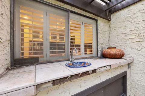a view of a kitchen counter top space and wooden floor