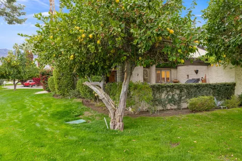 a view of an house with backyard space and garden