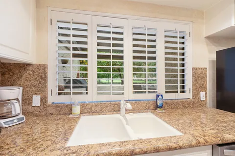 a view of a living room and a large window