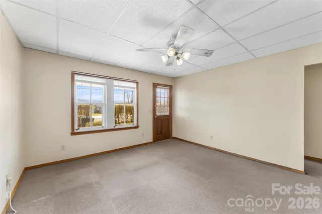 a view of an empty room with a window