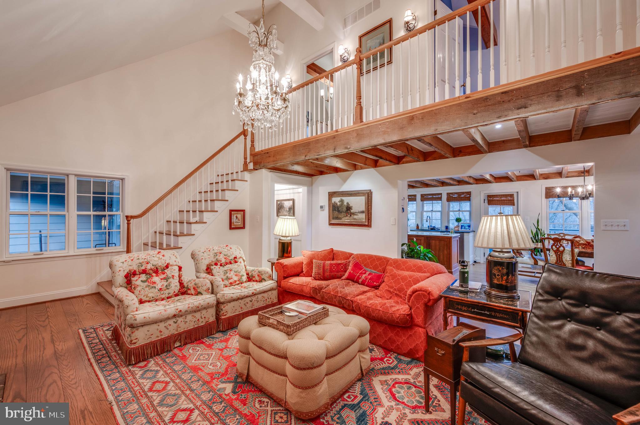3223 Mt Zion Road Upperco, MD 21155 - Photo 18 of 65 a living room with furniture a chandelier and a rug
