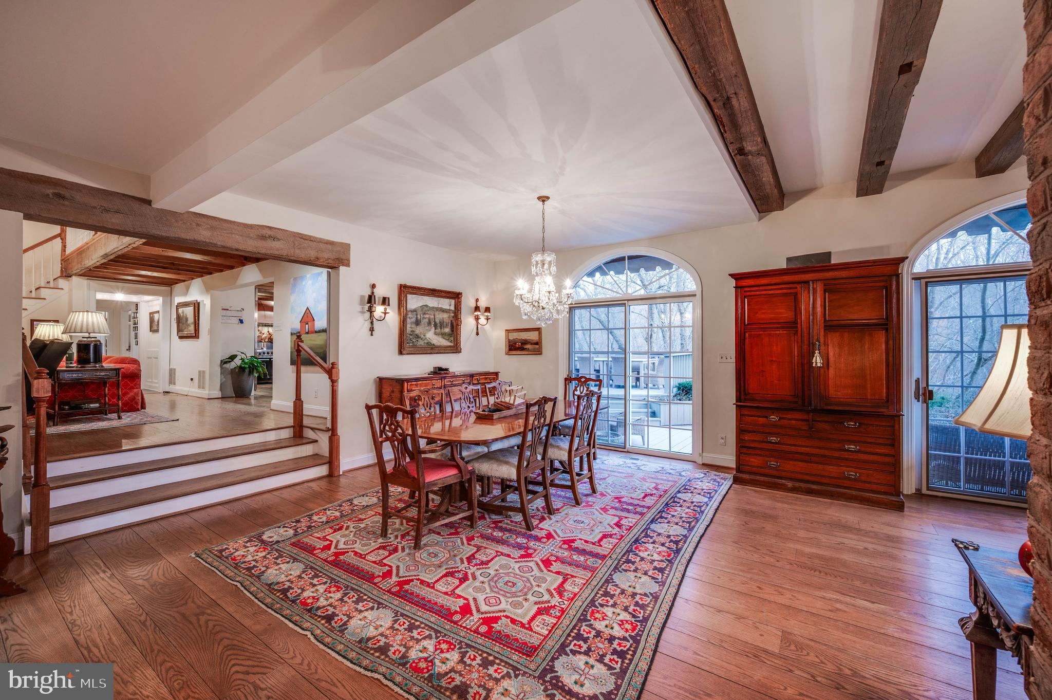 3223 Mt Zion Road Upperco, MD 21155 - Photo 19 of 65 a dining room with wooden floor a chandelier a wooden table and chairs