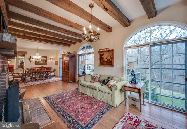 a view of a porch with wooden floor and a door
