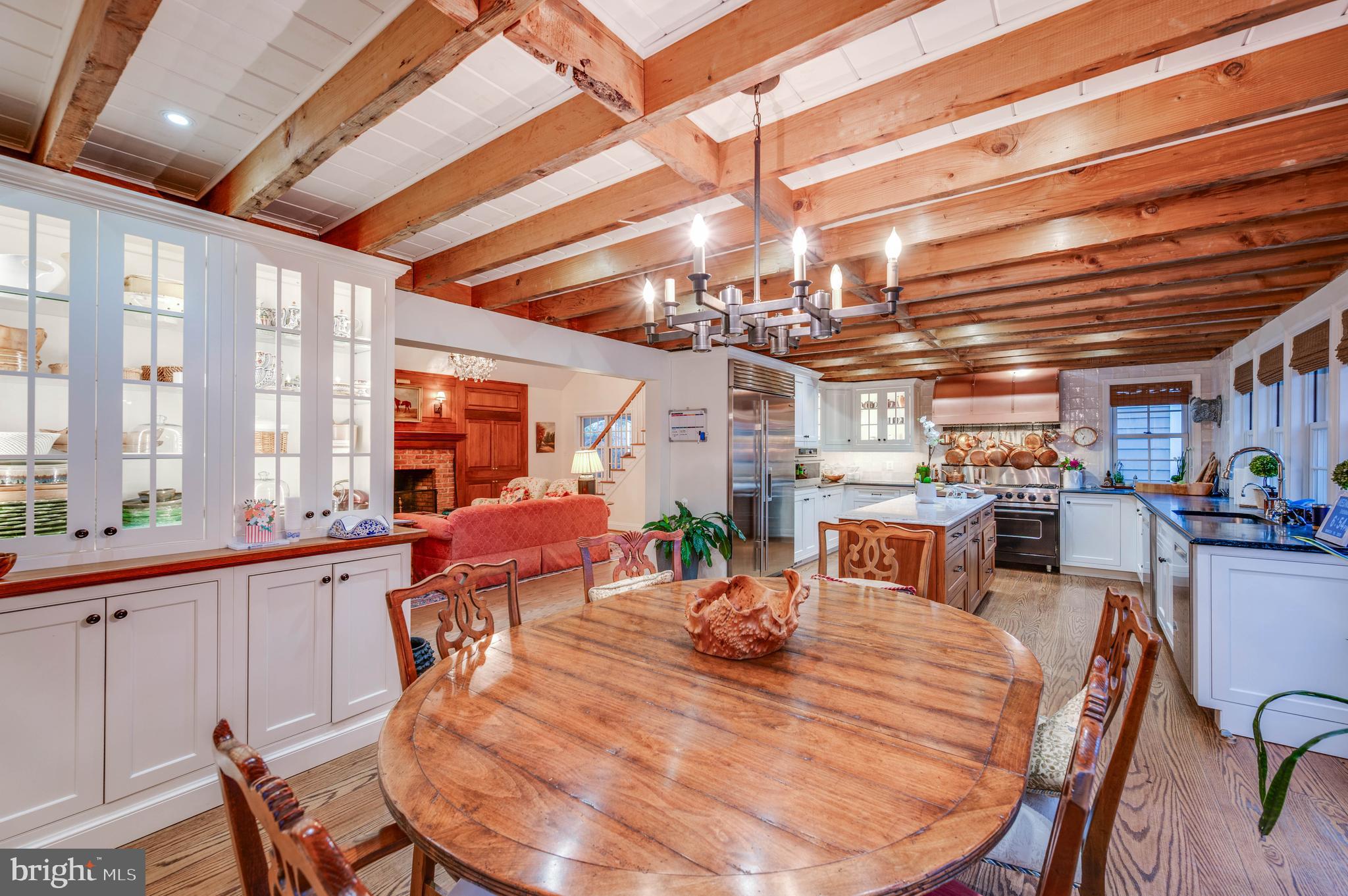 3223 Mt Zion Road Upperco, MD 21155 - Photo 3 of 65 a view of a dining room with furniture large windows and wooden floor