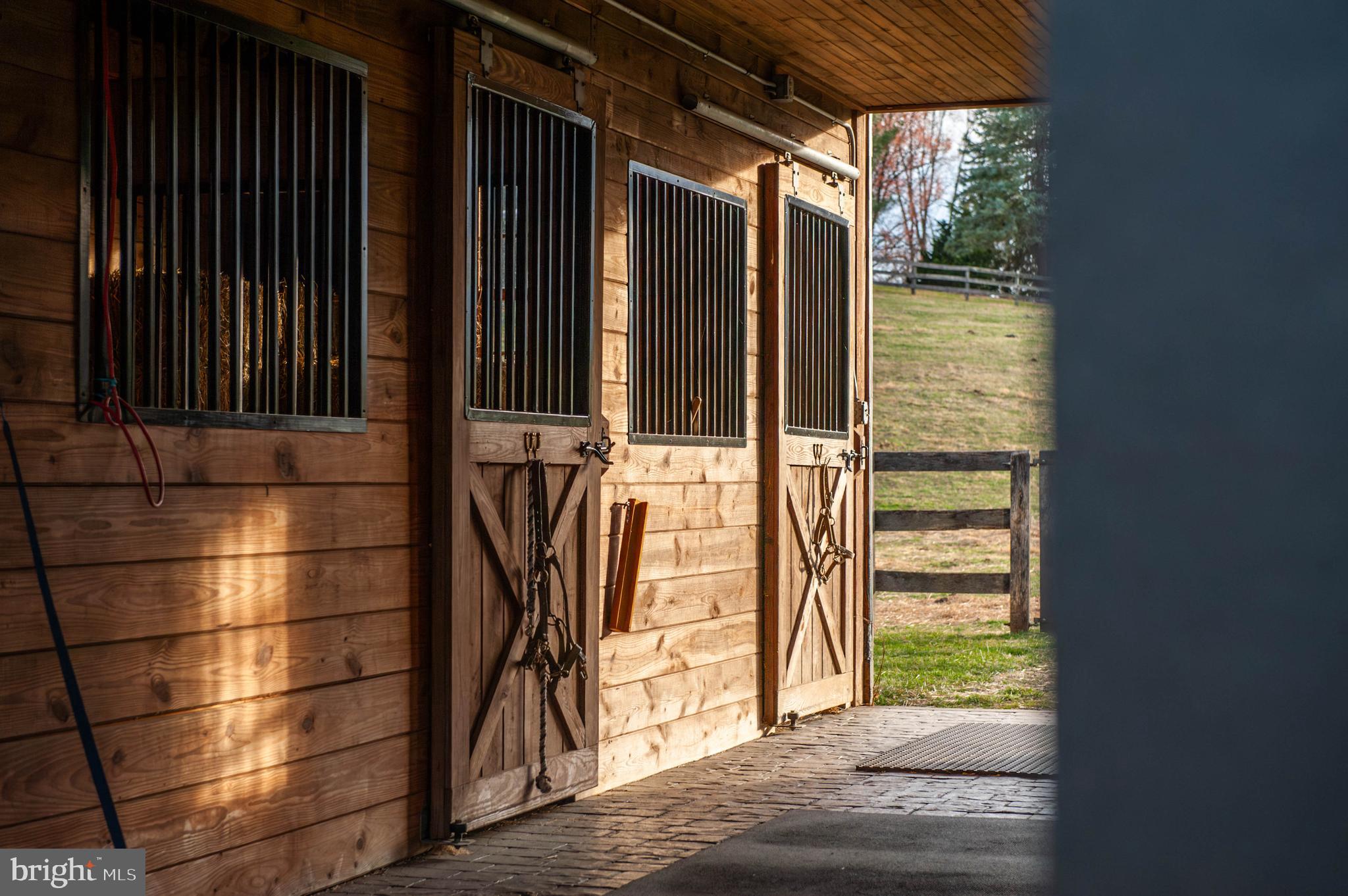 3223 Mt Zion Road Upperco, MD 21155 - Photo 31 of 65 a view of a porch with wooden floor and a door