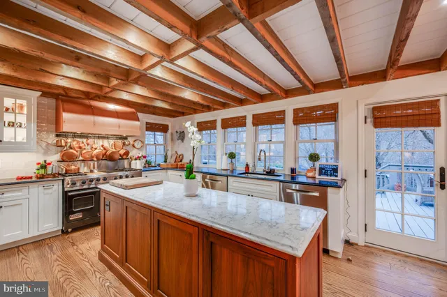 a view of street with with lots of green space and trees