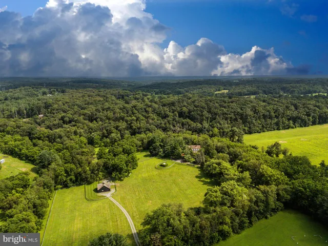 a view of a lake in front of house with a yard