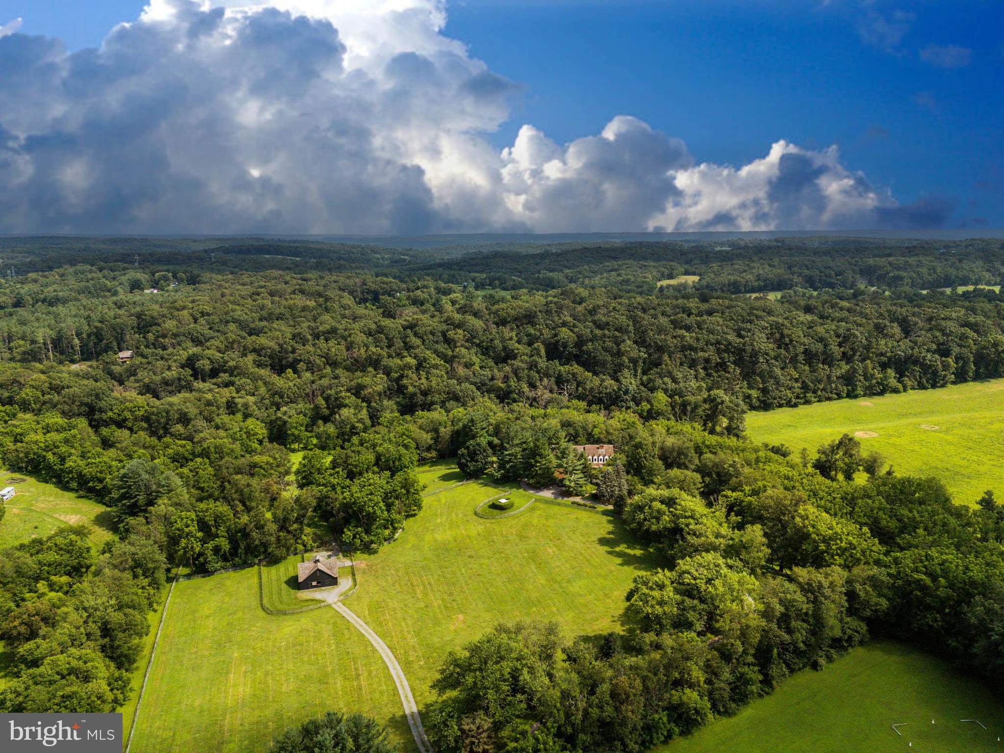 3223 Mt Zion Road Upperco, MD 21155 - Photo 4 of 65 a view of a lake in front of house with a yard