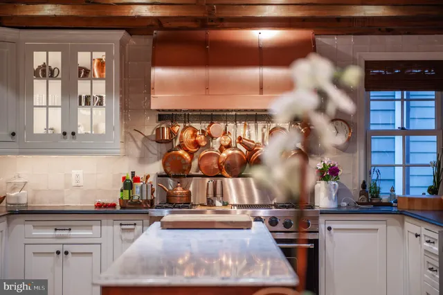 a bedroom with bed window and table