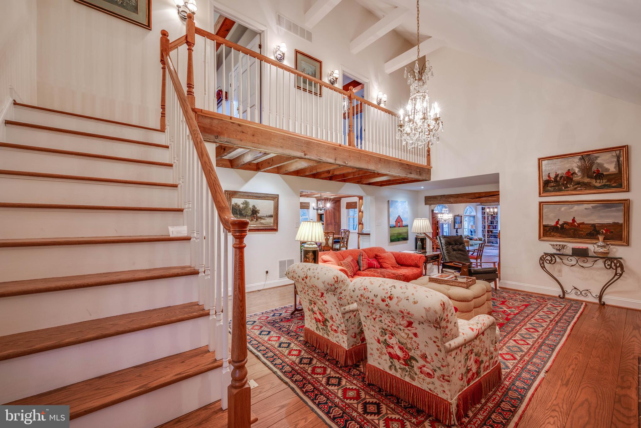 3223 Mt Zion Road Upperco, MD 21155 - Photo 44 of 65 a living room with furniture a rug and a chandelier