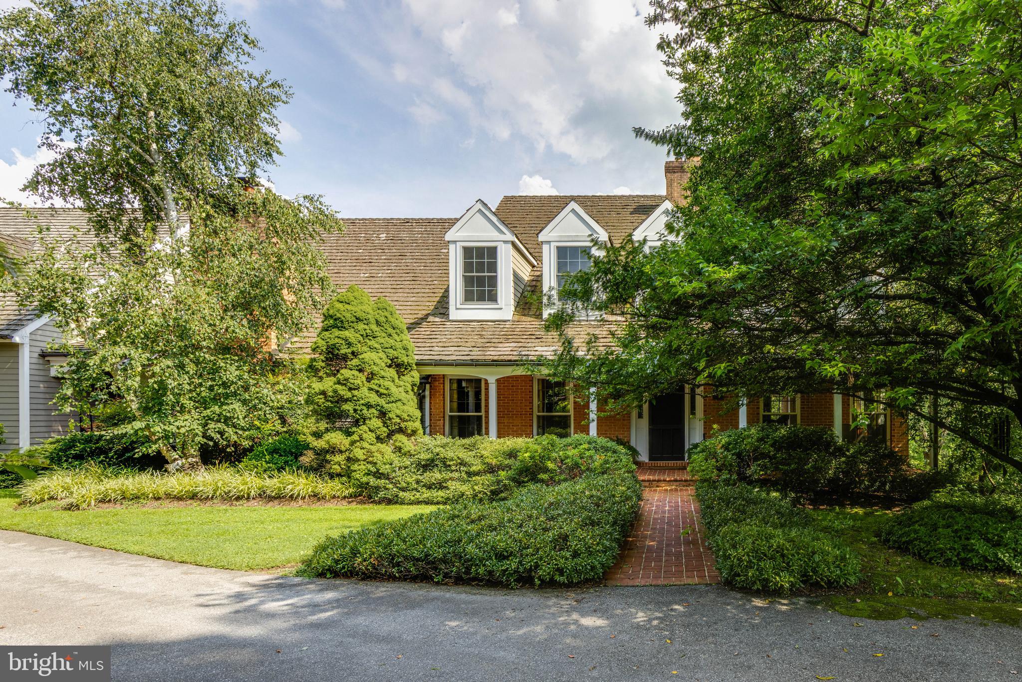 3223 Mt Zion Road Upperco, MD 21155 - Photo 10 of 65 a front view of a house with a garden
