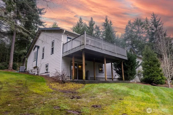 a view of a house with yard and entertaining space