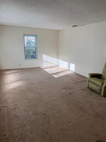 a view of empty room with windows