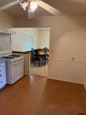a view of a kitchen with furniture and chandelier