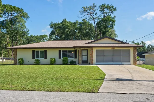a view of a house with a yard