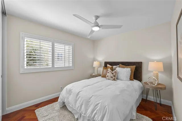 a bedroom with a bed and a night stand