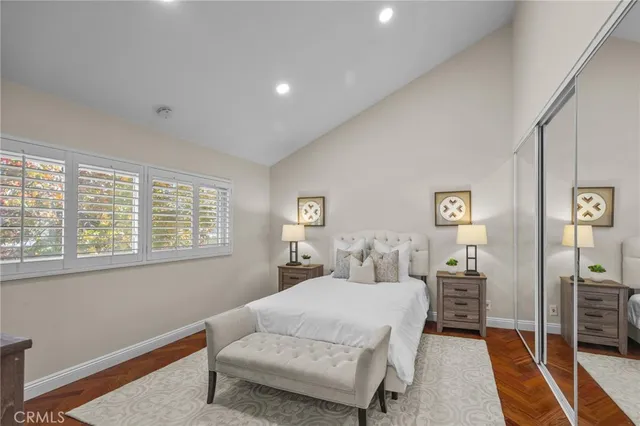 a bedroom with a bed and a couch