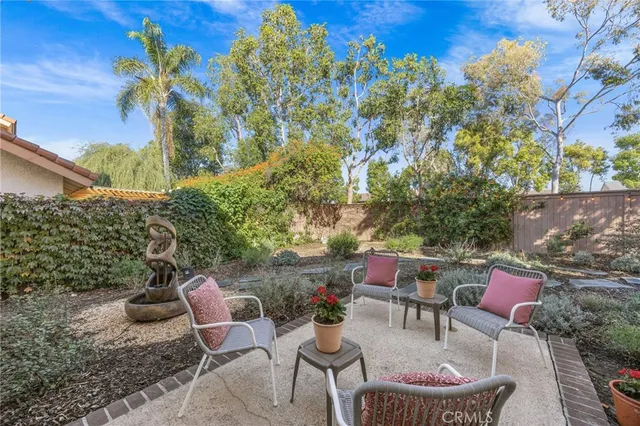 a backyard of a house with outdoor seating