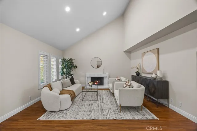 a living room with furniture rug and window