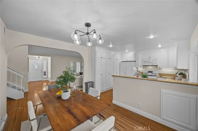 a kitchen with a table and chairs in it