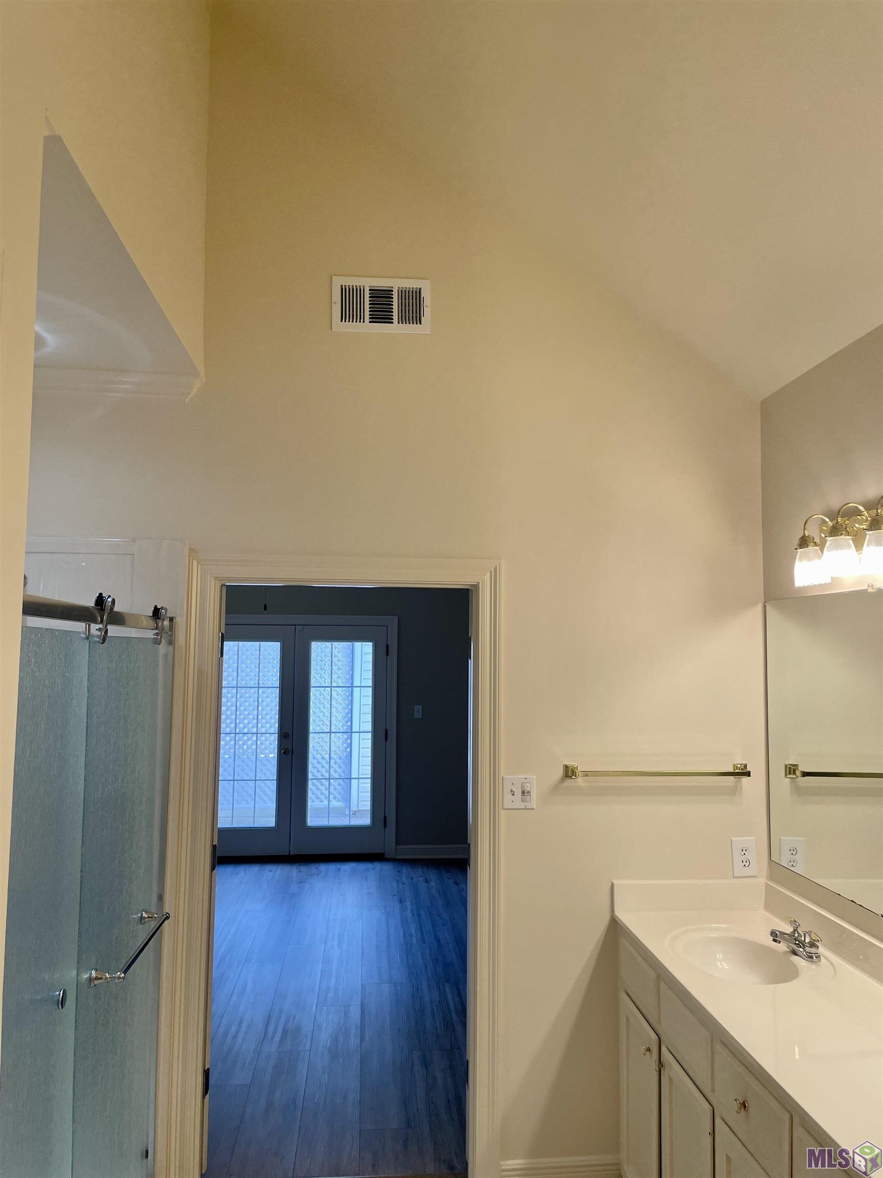 1741 Obrien Drive St. George, LA 70810 - Photo 8 of 27 Ensuite Bathroom to Primary BR to Patio