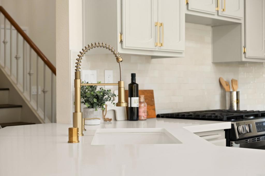 1361 Hodges Road Oceanside, CA 92056 - Photo 12 of 39 a kitchen with granite countertop a stove and a granite counter tops